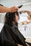 Why Your Hairstylist Always Asks Where You Part Your Hair